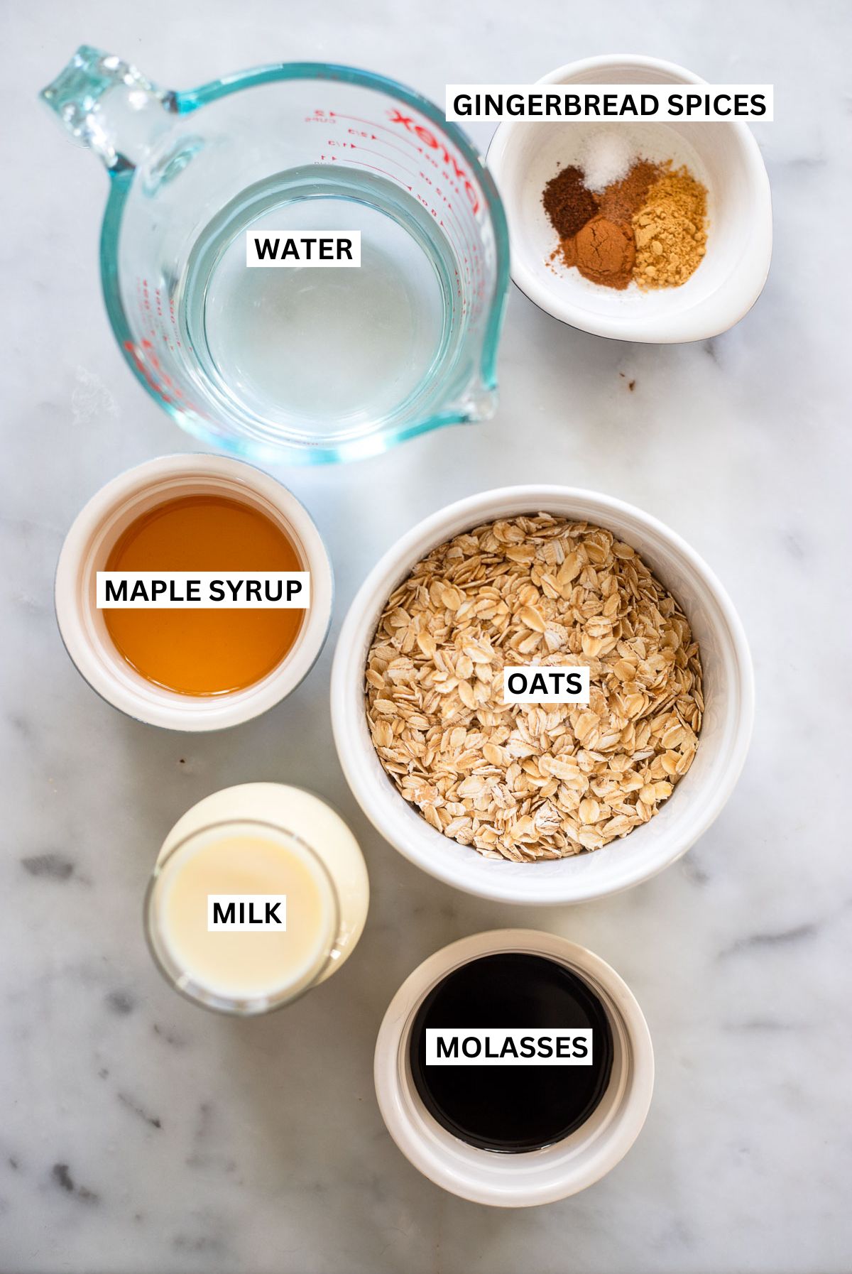 gingerbread oatmeal ingredients in small bowls with labels.