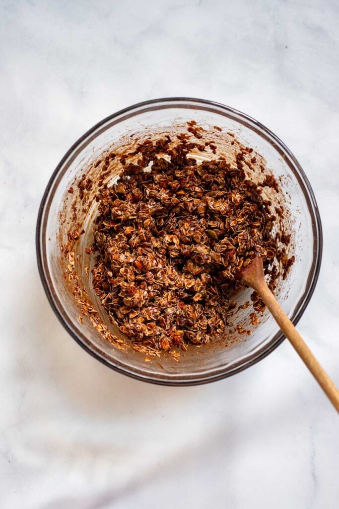 chocolate granola ingredients in large bowl stirred together. 