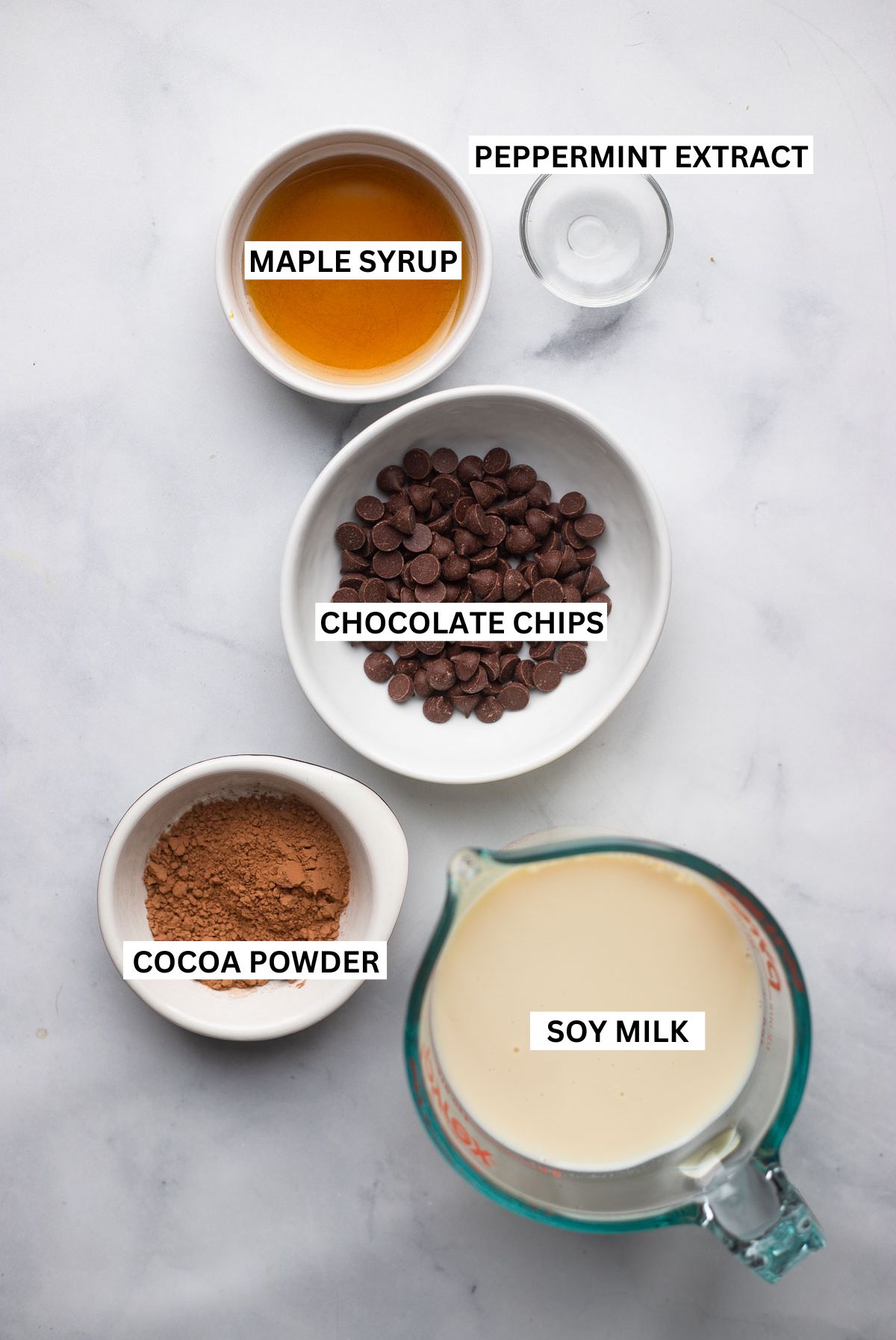 peppermint hot chocolate ingredients in bowls with labels.