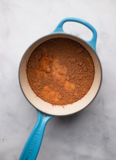 small saucepan with hot chocolate ingredients added before cooking.
