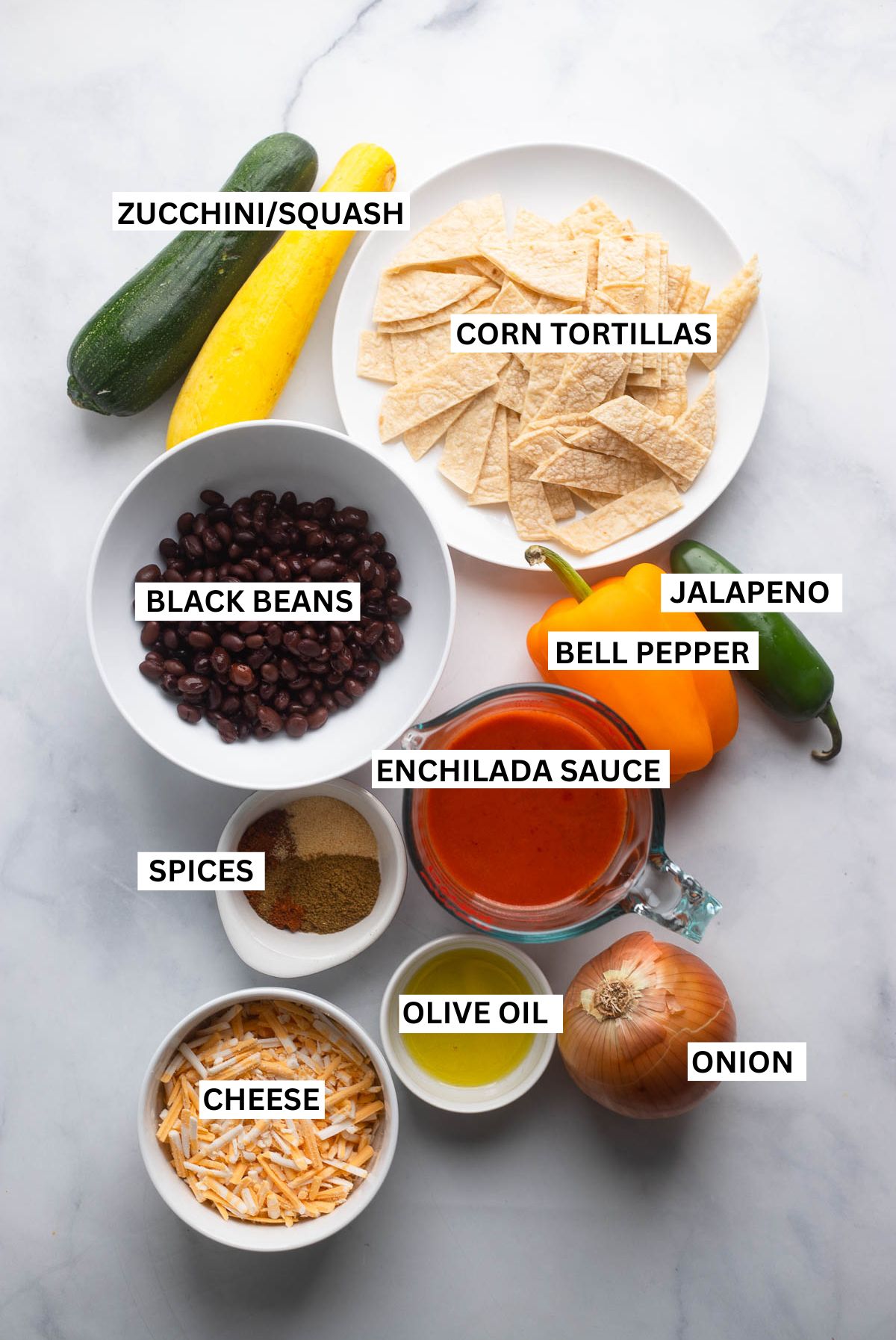 enchilada skillet ingredients in small bowls with labels. 