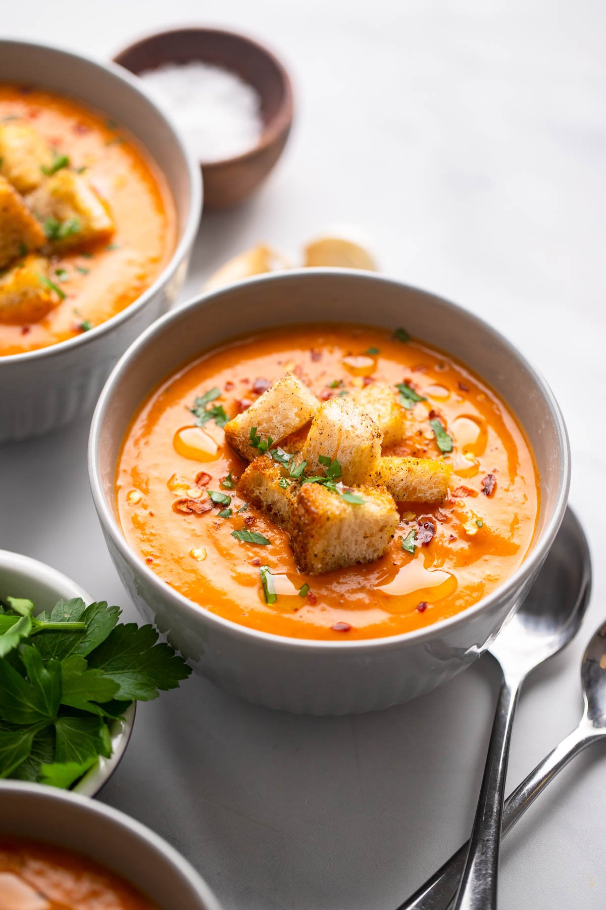 Butternut Squash and Red Pepper Soup in a bowl garnished with croutons.