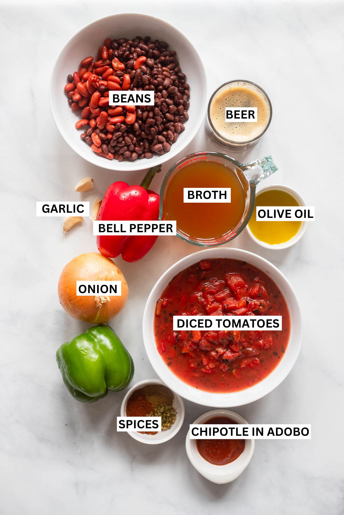 Vegetarian chipotle chili ingredients in small bowls. Each ingredient is labelled with text.