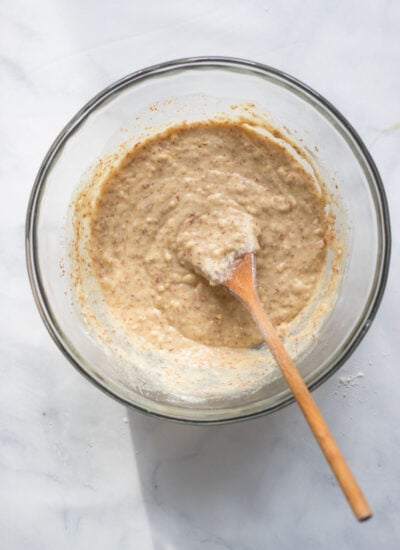 lemon loaf batter in mixing bowl with spoon.