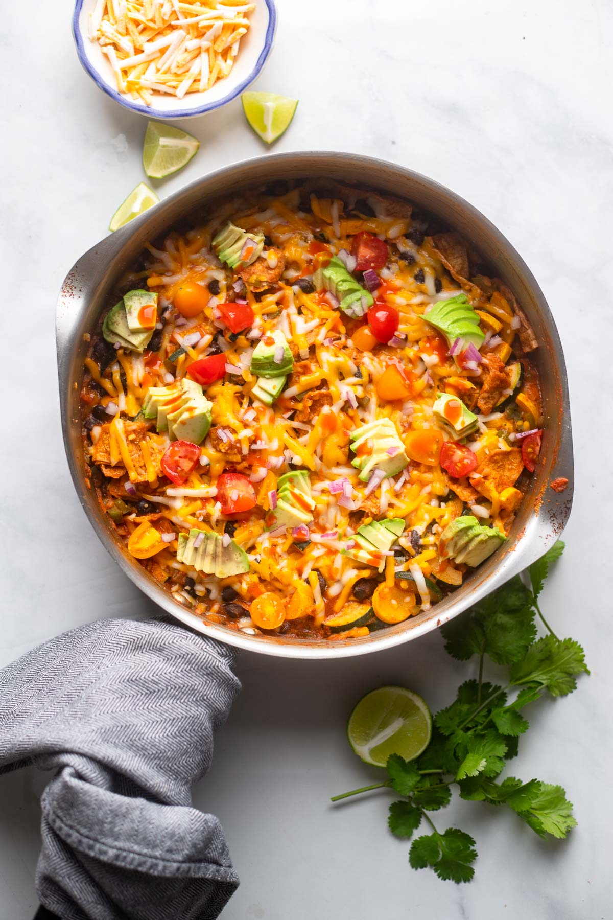 vegetarian black bean skillet enchiladas with napkin on the pan handle.