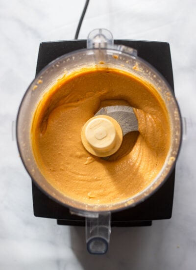 peanuts blended into a smooth creamy peanut butter in food processor.