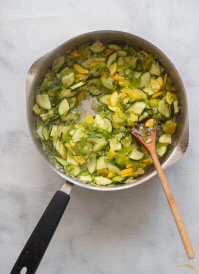 cooked onion, zucchini, and bell pepper in a skillet. 