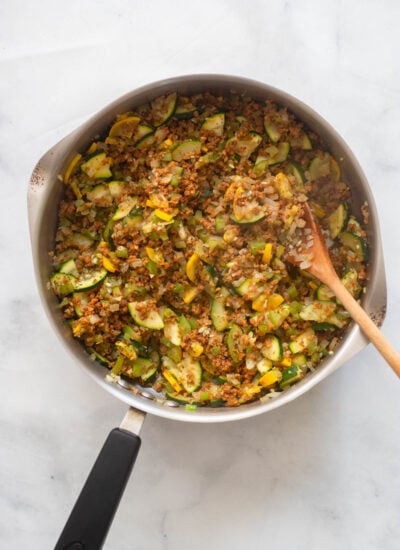 vegan ground beef added to the cooked vegetables in a large skillet. 