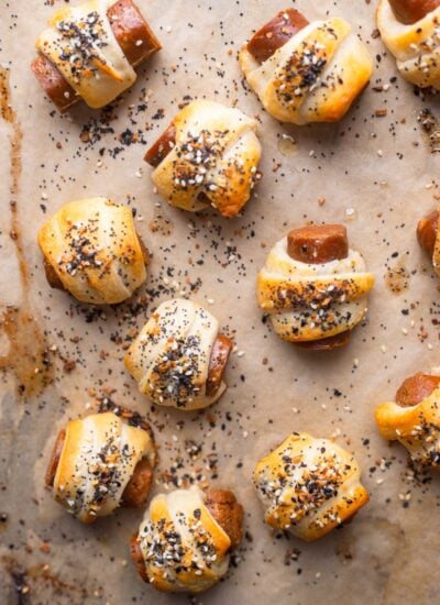 baked pigs in a blanket on a baking sheet. 
