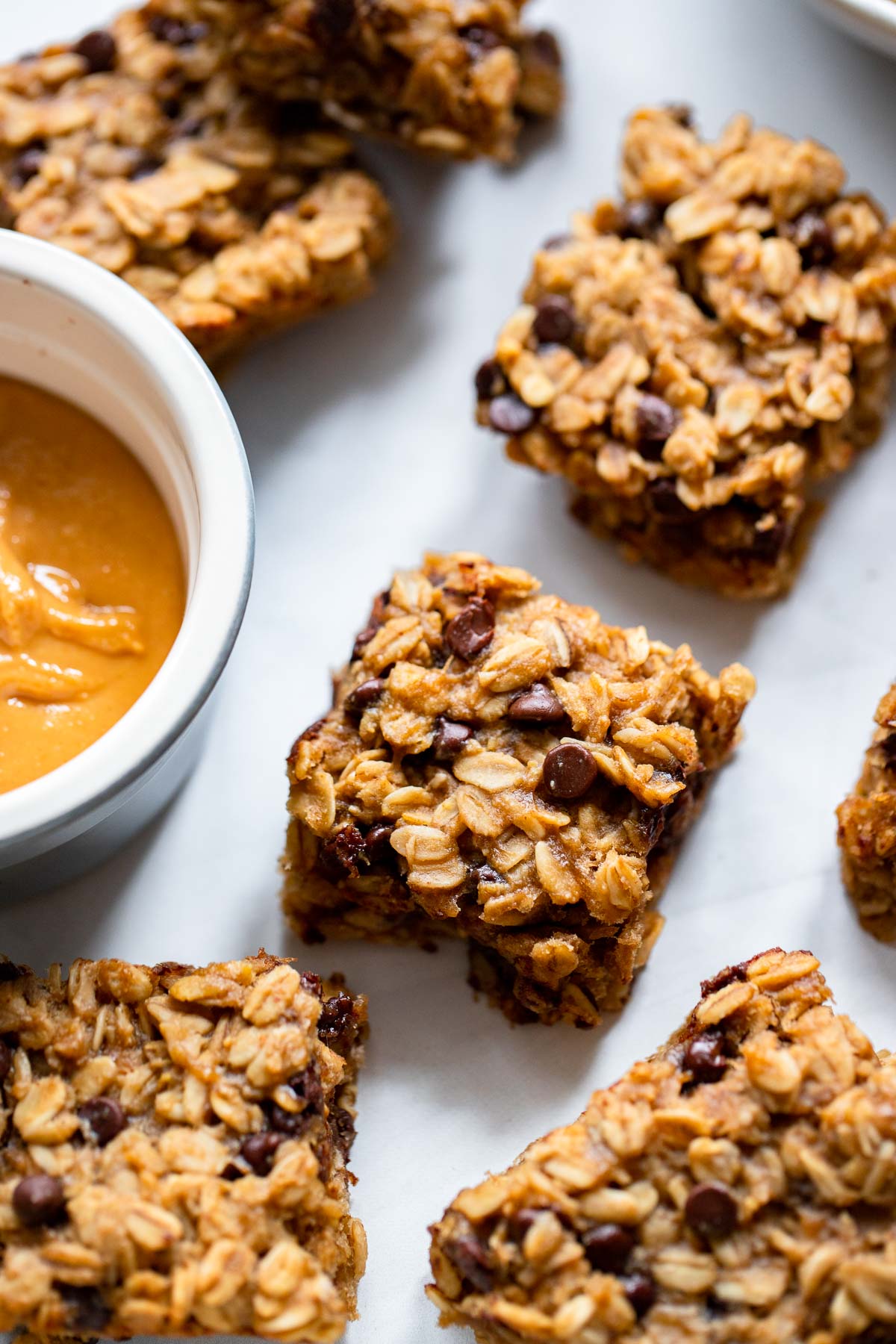 peanut butter banana oatmeal bars on white background.