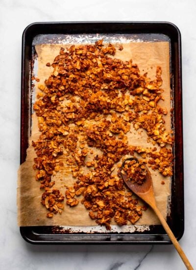 vegan coconut bacon spread into single layer on parchment lined baking sheet. 