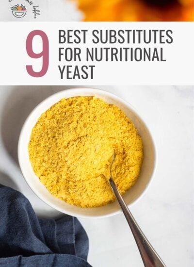 nutritional yeast in a small white dish with a spoon.