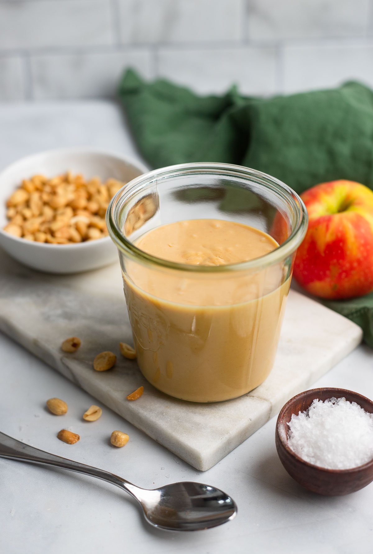 creamy homemade peanut butter in a 1/2 liter glass jar.