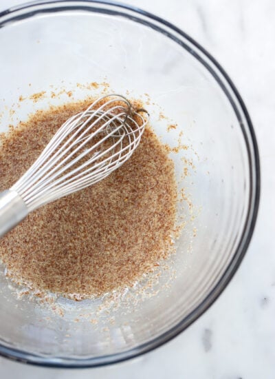 vegan flax egg in a mixing bowl with a whisk.