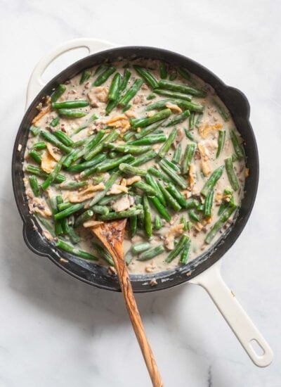 vegan green bean casserole in skillet before topping with onions. 