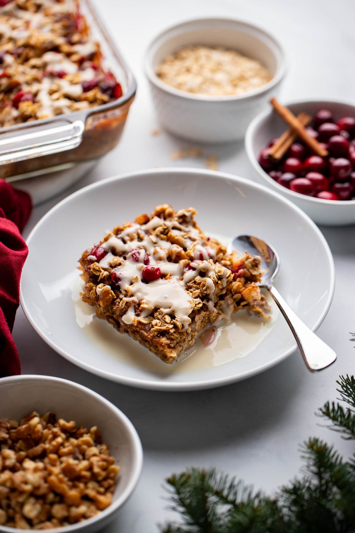 since of cranberry baked oatmeal in a bowl topped with milk. 
