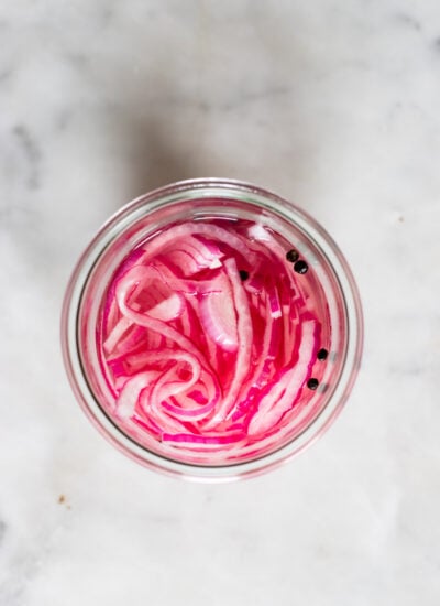 pickled red onions in a jar before storing in the fridge. 