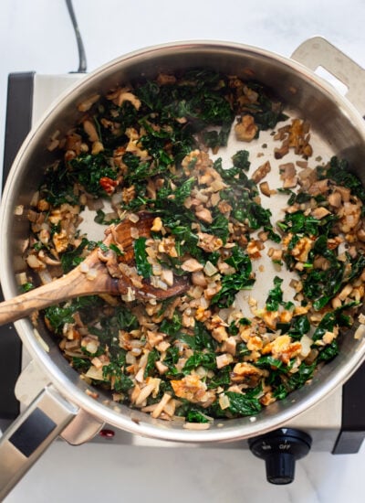butternut squash filling in a skillet on the stovetop.