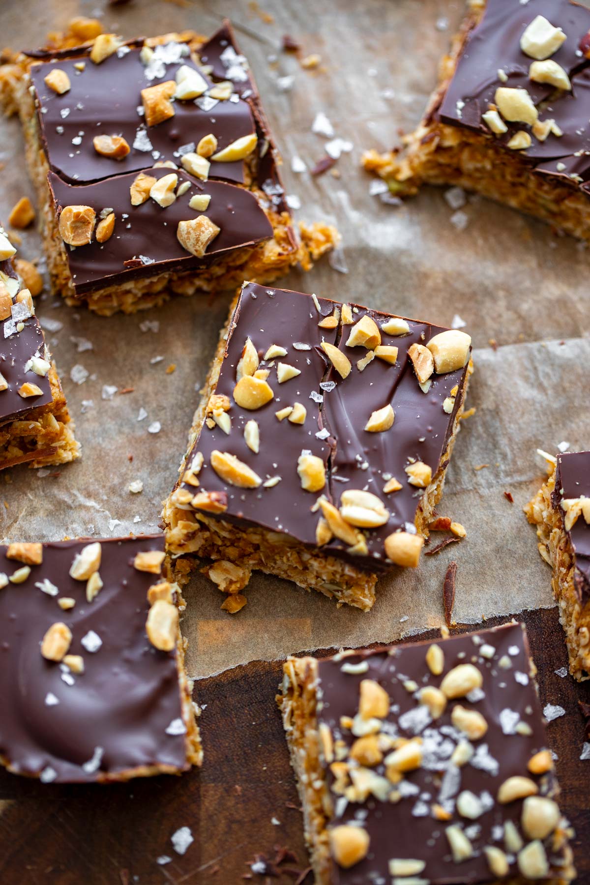 no bake peanut butter oatmeal bars cut into squares on a piece of parchment. 