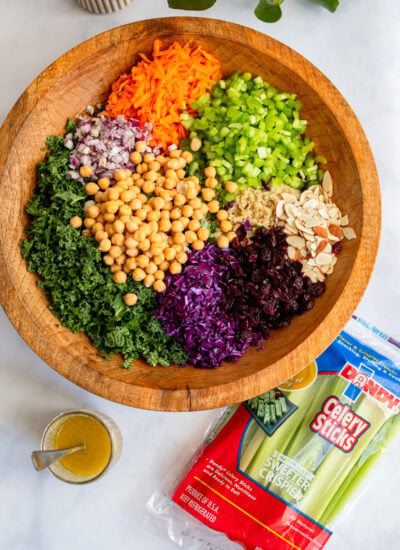 kale salad in a large wooden serving bowl. 