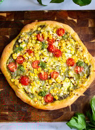 baked corn pizza hot from the oven before garnishing.