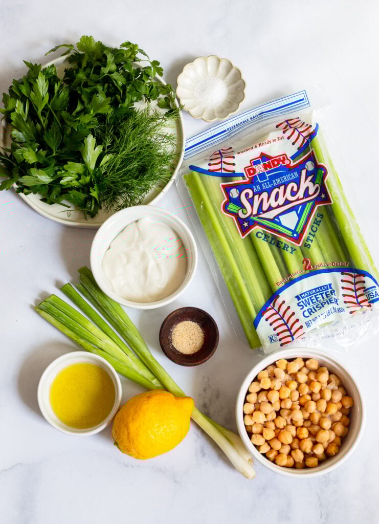 ingredients for green goddess chickpea salad on a white background. 