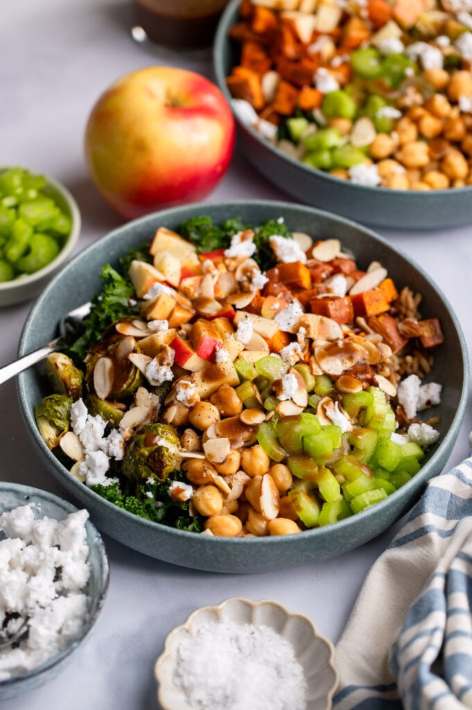 fall harvest bowl topped with celery, almonds, and chickpeas.