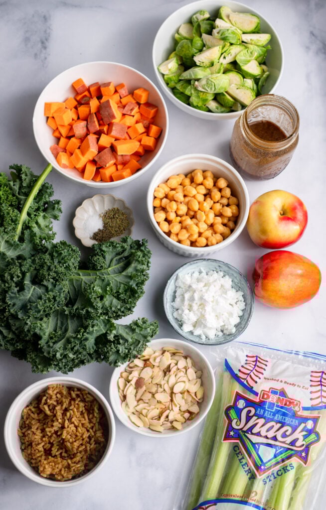 fall harvest bowl ingredients in bowls on a white background
