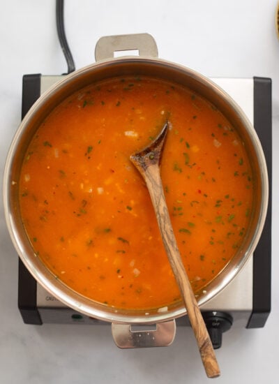 onions, broth, and pumpkin stirred together in a skillet