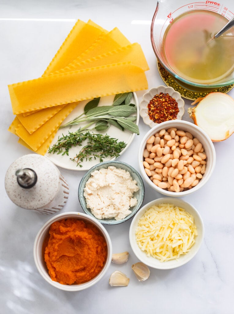 pumpkin skillet lasagna ingredients arranged on a white background. 