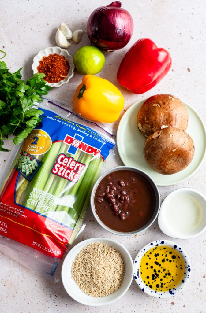 ingredients for fiesta fajita bowls on a gray backdrop