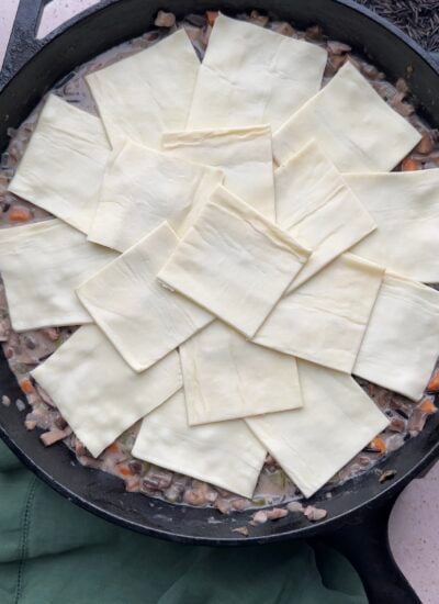 pot pie topped with puff pastry before baking. 