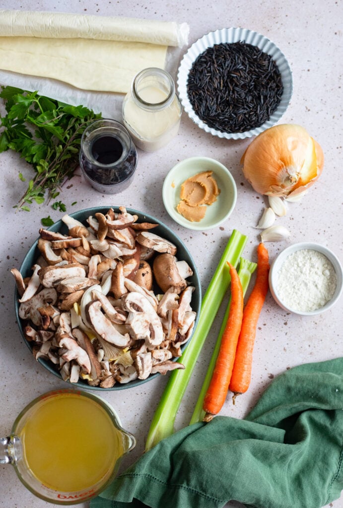 ingredients for mushroom pot pie laid out on a table. 