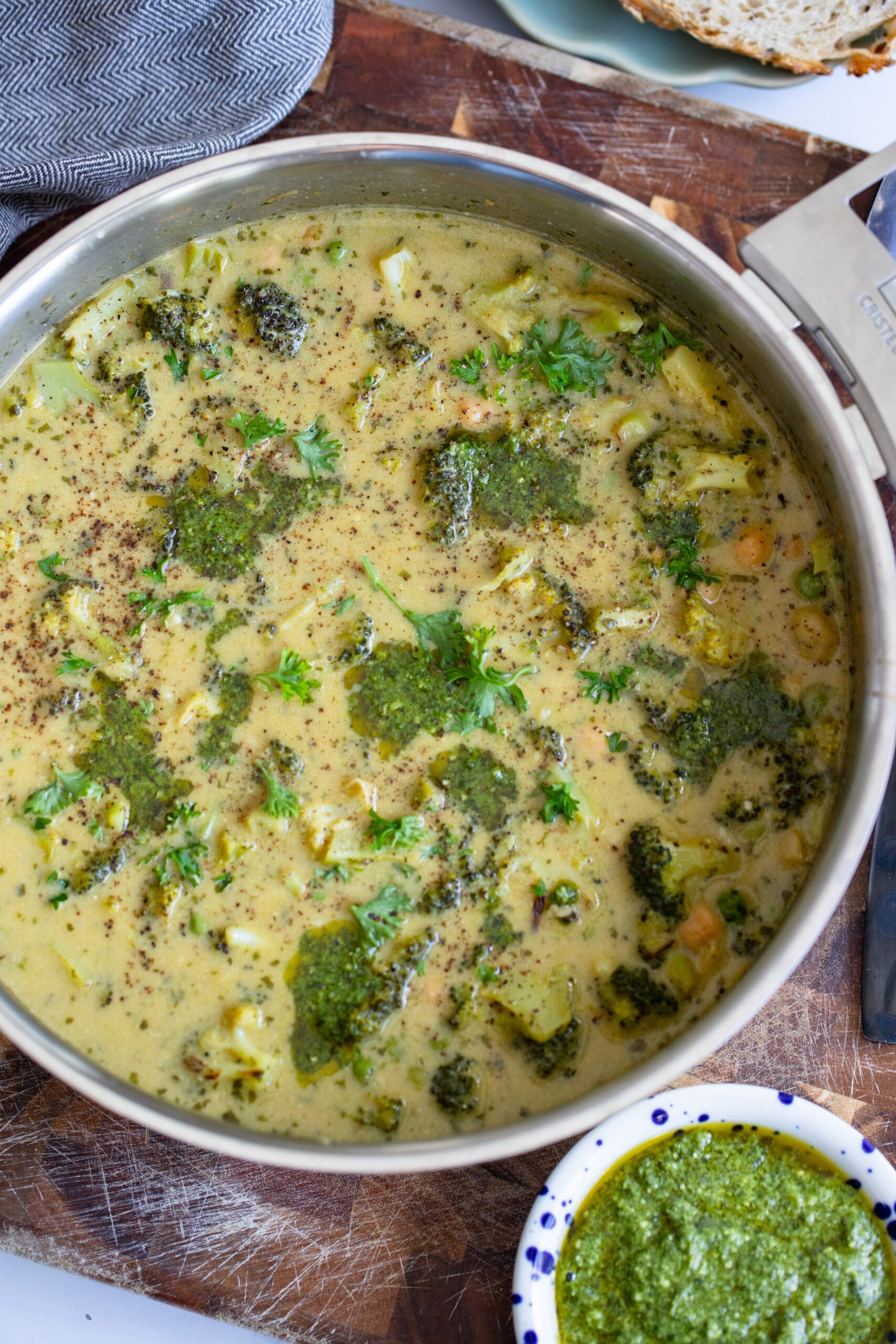 creamy broccoli and chickpea skillet on a wood backdrop