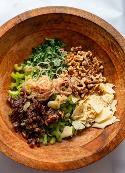 celery salad ingredients in a large wooden bowl