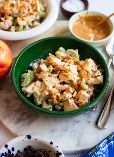 ants on a log apple salad in a green bowl