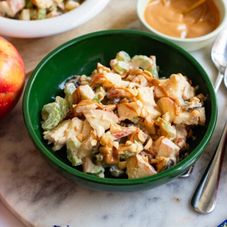 ants on a log apple salad in a green bowl