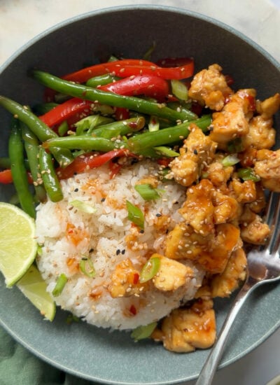 sticky tofu bowl with rice and stir fried vegetables. 