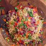 cold ramen noodle salad mixed up in a large wooden serving bowl