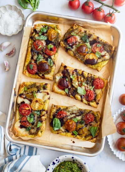 mini tomato tarts on a sheet pan