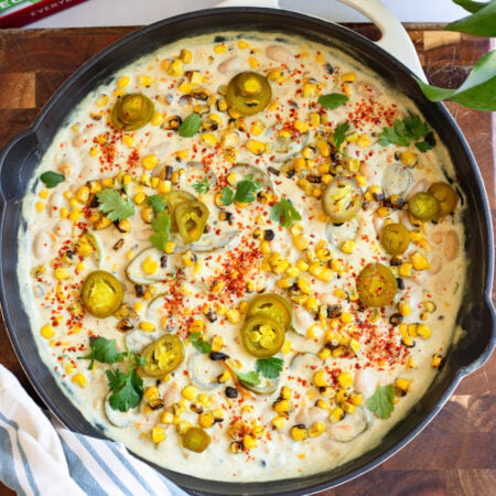 creamy corn jalapeno bean dip in a skillet
