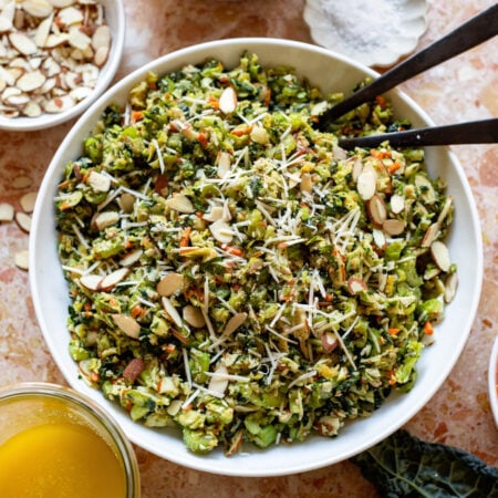 kale brussels and celery slaw in a serving bowl